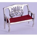 A MINIATURE SILVER SOFA. 5 cm wide.