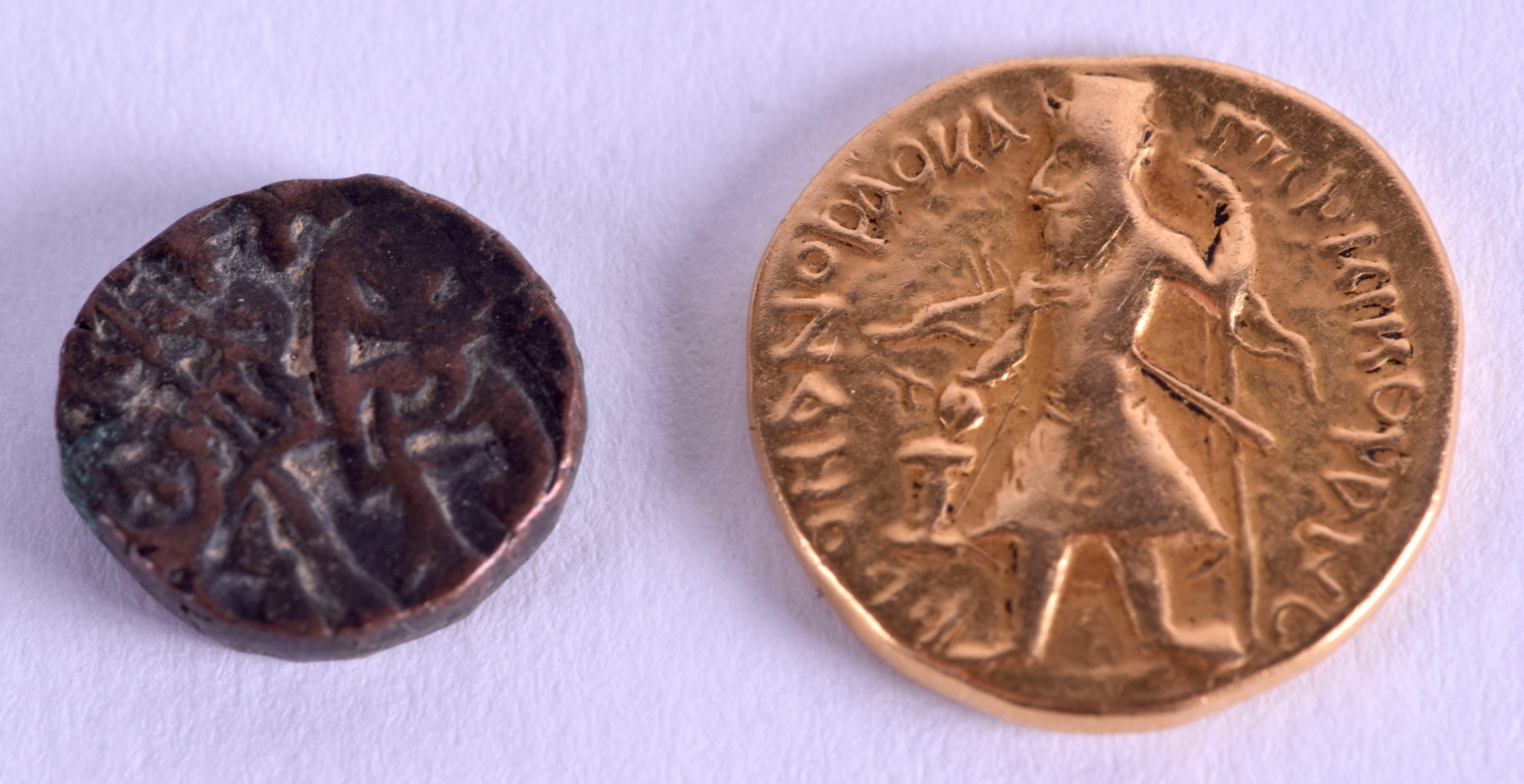 AN EARLY EUROPEAN GOLD COIN possibly Greek, together with another coin. Gold 7.9 grams. (2)