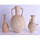 THREE EARLY ANTIQUITY TERRACOTTA VASES. Largest 25 cm high. (3)