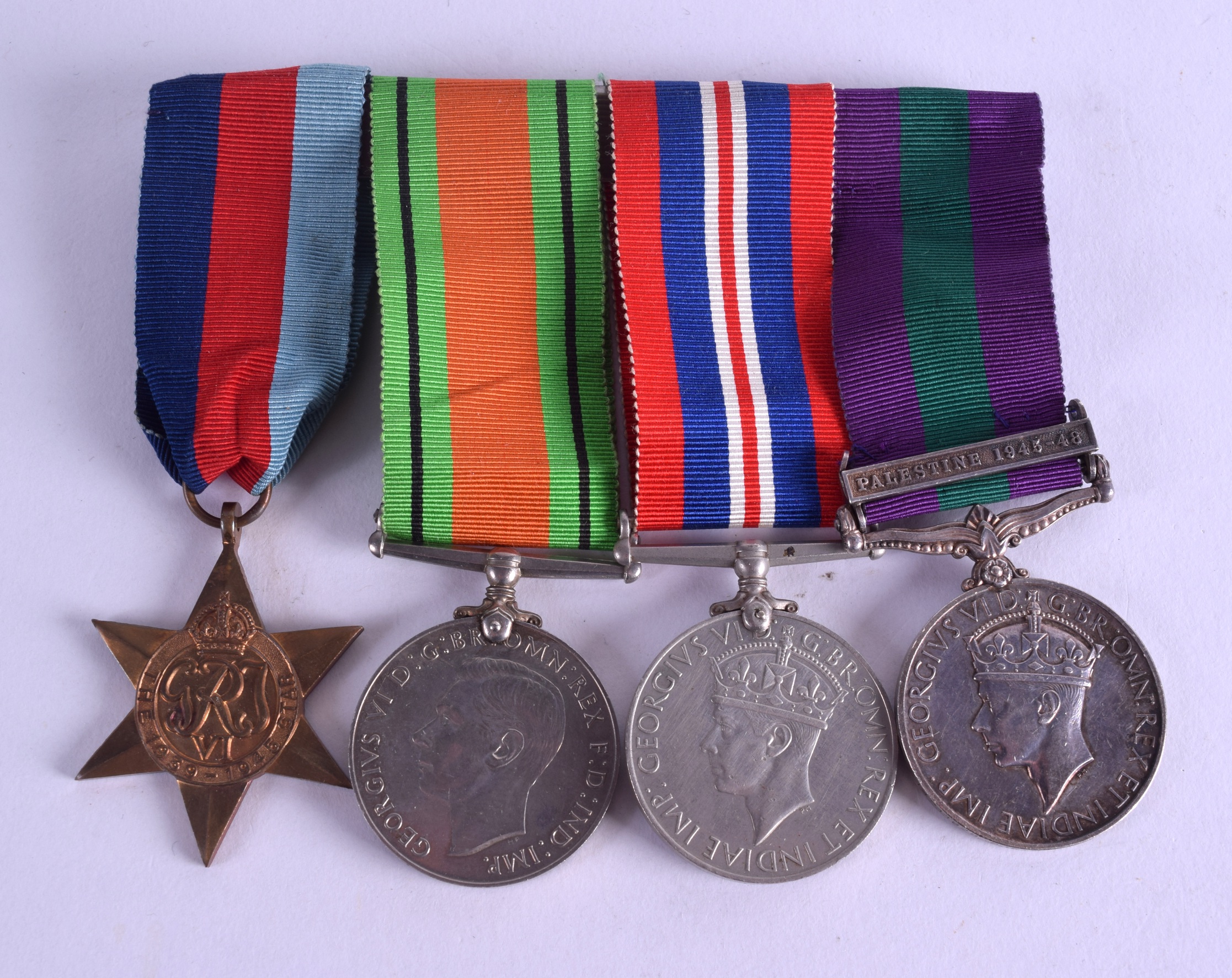 FOUR WWII MEDALS presented to 14211828 pte d ferguson b w. (4)