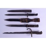 THREE MILITARY KNIVES two with scabbards. 43 cm long. (3)