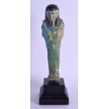 AN EGYPTIAN FAIENCE GLAZED USHABTI. Shabti 19 cm high.