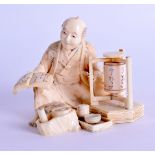 A 19TH CENTURY JAPANESE MEIJI PERIOD CARVED IVORY OKIMONO modelled as a seated male holding an