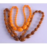 TWO AMBER TYPE NECKLACES. (2)