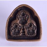 A 19TH CENTURY CHIENSE TIBETAN BRONZE AMULET decorated with three buddhas. 5 cm wide.