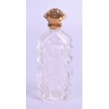 A 19TH CENTURY FRENCH GOLD MOUNTED CRYSTAL SCENT BOTTLE. 11 cm high.