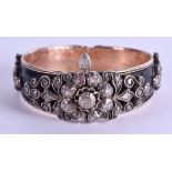 AN UNUSUAL MID 19TH CENTURY CONTINENTAL GOLD AND DIAMOND HINGED BANGLE. 55.1 grams. 6.75 cm wide.
