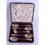 A SET OF FOUR 18TH CENTURY SILVER GILT SPOONS with matching sifter, decorated with foliage. 242