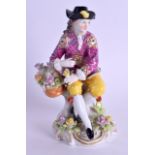 A 19TH CENTURY FRENCH CHELSEA STYLE FIGURE OF A GALLANT modelled wearing pink robes. 14 cm high.