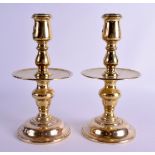 A PAIR OF 19TH CENTURY CONTINENTAL BRASS DRIP PAN CANDLESTICKS. 23.5 cm high.