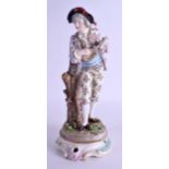 A 19TH CENTURY GERMAN PORCELAIN ENCRUSTED FIGURE OF A MUSICIAN painted with flowers. 28 cm high.