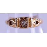 AN 18CT GOLD AND DIAMOND SINGLE STONE RING. 3.1 grams. Size M.