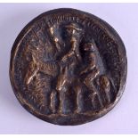 AN UNUSUAL CONTINENTAL BRONZE MEDALLION depicting a figure upon a donkey to one side, a portrait