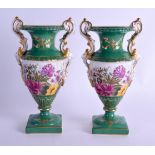 A PAIR OF EARLY 20TH CENTURY CONTINENTAL PORCELAIN VASES Sevres style, painted with flowers. 19 cm