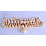 TWO 19TH CENTURY CARVED IVORY NECKLACES together with a 19th century gold and ivory heart. (3)