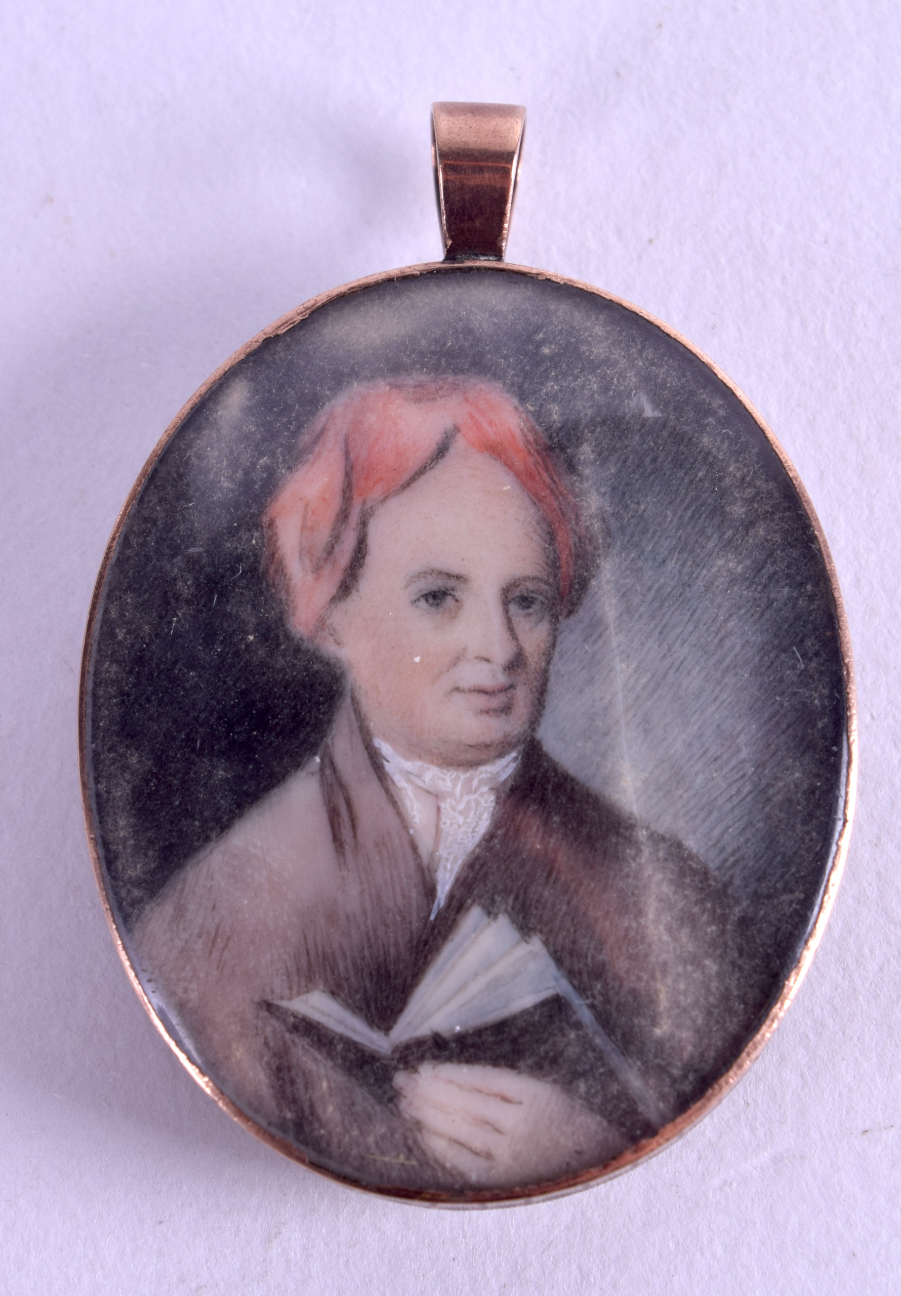 AN EARLY 19TH CENTURY PAINTED IVORY PORTRAIT MINIATURE depicting a male wearing a red hat. Image 3