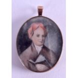 AN EARLY 19TH CENTURY PAINTED IVORY PORTRAIT MINIATURE depicting a male wearing a red hat. Image 3