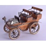 A RARE 1920S SILVER PLATED CARVED WOOD AUTMOBILE SMOKING COMPENDIUM in the form of a car. 19 cm x 12