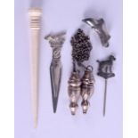 A SILVER BOOT together with four other silver items & a bone tool. (6)