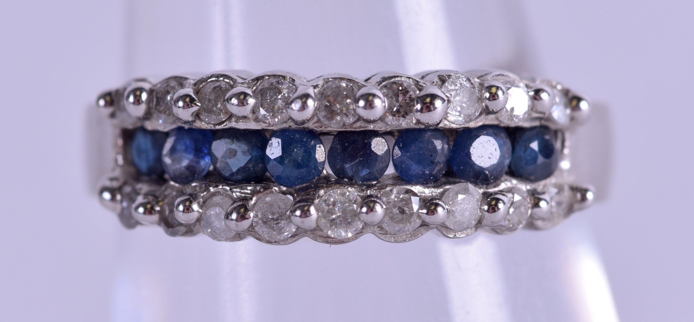 A 14CT GOLD DIAMOND AND SAPPHIRE RING. Size L/M.