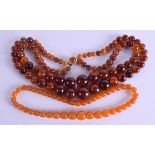 TWO AMBER TYPE NECKLACES.140 grams. (2)