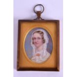 AN EARLY VICTORIAN PAINTED IVORY PORTRAIT MINIATURE depicting a female wearing white head dress.