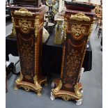 A LARGE PAIR OF WOODEN PEDESTAL STANDS, formed with ormolu mounts and marble top. 139 cm.