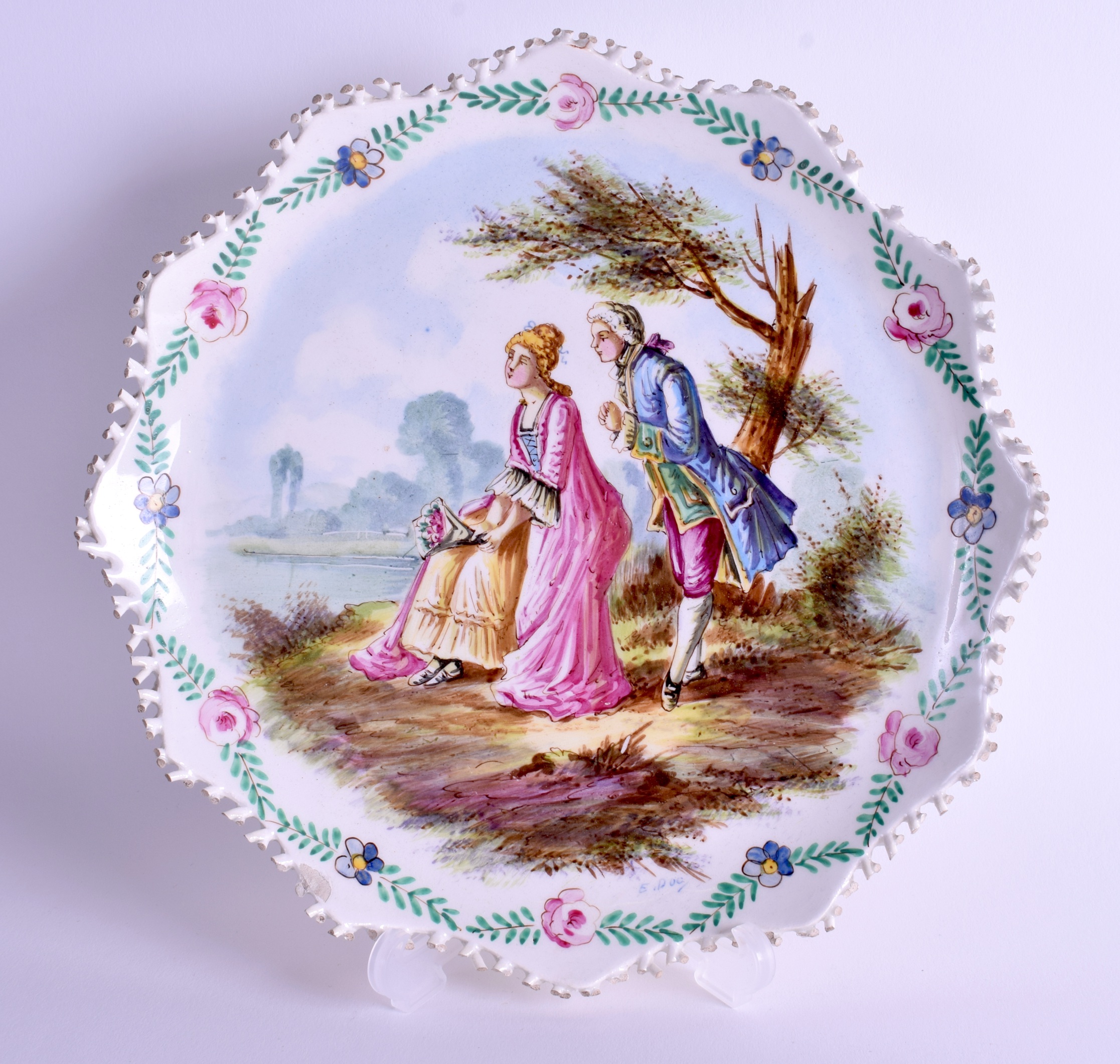 A 19TH CENTURY FRENCH LILLE POTTERY CIRCULAR PLATE bearing pseudo 1767 marks to base, painted with l