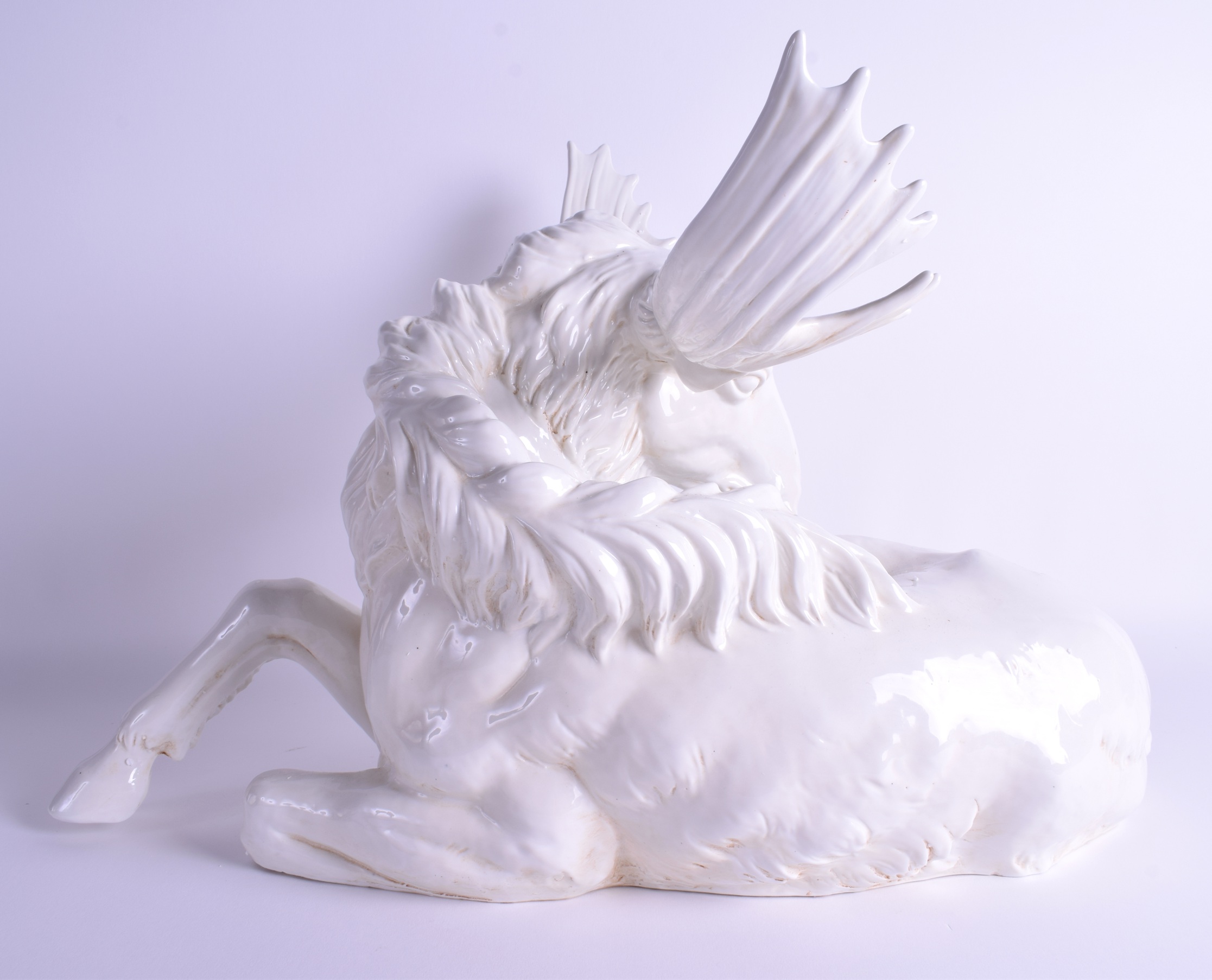 A LARGE CONTINENTAL PORCELAIN GROUP OF A RECUMBANT MOOSE modelled with its head turned. 52 cm x 37 c - Image 3 of 4