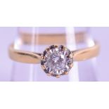 AN 18CT GOLD DIAMOND SOLITAIRE RING. Size Q/R. 4 grams.