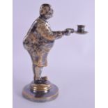 A CHARMING ANTIQUE DANISH SILVER PLATED GILDED CANDLESTICK modelled as a rotund waiter showing his p