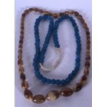 A CHINESE CARVED BUFFALO HORN NECKLACE, together with a blue necklace. Horn 54 cm long.