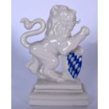 A NYMPEHBURG PORCELAIN FIGURE OR FIGURINE OF A HERALDIC LION, modelled with one paw resting upon a s