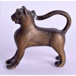 AN 18TH CENTURY SOUTH EAST ASIAN BRONZE LION modelled in a standing stance. 7 cm x 7 cm.