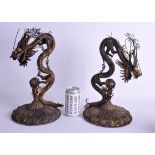 A VERY RARE PAIR OF 18TH CENTURY CHINESE SILVER GILT DRAGONS Qianlong/Jiaqing, modelled coiled upon