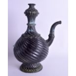 A LARGE 19TH CENTURY MIDDLE EASTERN INDIAN BRONZE EWER of spirally fluted form. 32 cm x 18 cm.