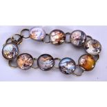 AN UNSEAL AFTER SALVADOR DALI ABSTRACT BRACELET, formed with glass panels containing various images.