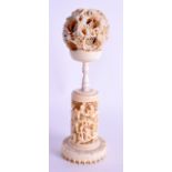 A 19TH CENTURY CHINESE CARVED IVORY PUZZLE BALL ON STAND Qing, decorated with figures and landscapes