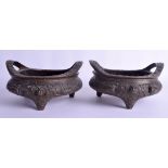 A RARE PAIR OF 19TH CENTURY CHINESE TWIN HANDLED BRONZE CENSERS bearing Xuande marks to base, decora