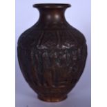 A 19TH CENTURY INDIAN BRONZE VASE, decorated in relief with figures in various pursuits under foliat