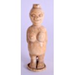 A 19TH CENTURY AFRICAN CARVED IVORY FIGURE OF A FEMALE modelled with a baby upon her back. 8 cm high