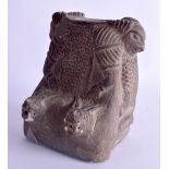 AN UNUSUAL CARVED CENTRAL ASIAN STONE IDOL possibly 19th century, with serpent/rams head mounts. 19