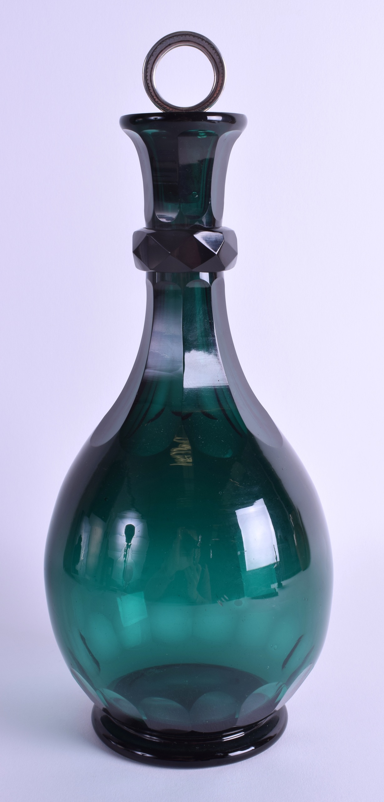 AN 18TH/19TH CENTURY CONTINENTAL GREEN GLASS BOTTLE with facetted base. 28 cm high.
