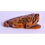 A RARE 18TH CENTURY JAPANESE EDO PERIOD CARVED IVORY NETSUKE in the form of a recumbent beast. 5 cm