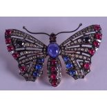 A GOLD SILVER SAPPHIRE AND RUBY BUTTERFLY BROOCH. 9 cm x 4.5 cm.