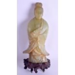 A 19TH CENTURY CHINESE CARVED JADE FIGURE OF GUANYIN modelled holding a scroll. Jade 23 cm high.
