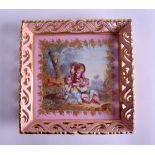 AN EARLY 19TH CENTURY SEVRES STYLE PORCELAIN TRAY painted with three figures on a pink ground. 16 cm