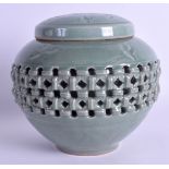 AN EARLY 20TH CENTURY KOREAN CELADON GINGER JAR AND COVER of openwork form, decorated with birds. 16