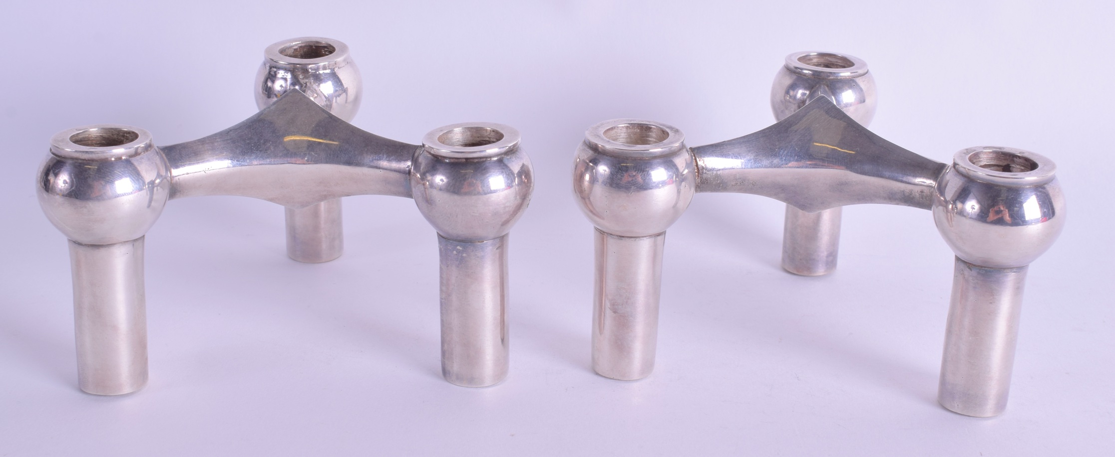 A PAIR OF 1950S CONTINENTAL WHITE METAL CANDLESTICKS. 23.2 oz. 11 cm wide.