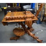 AN UNUSUAL CARVED NATURALISTIC LIMEWOOD DESK, formed with a shell upon an "X" shaped base. 95 cm x 7